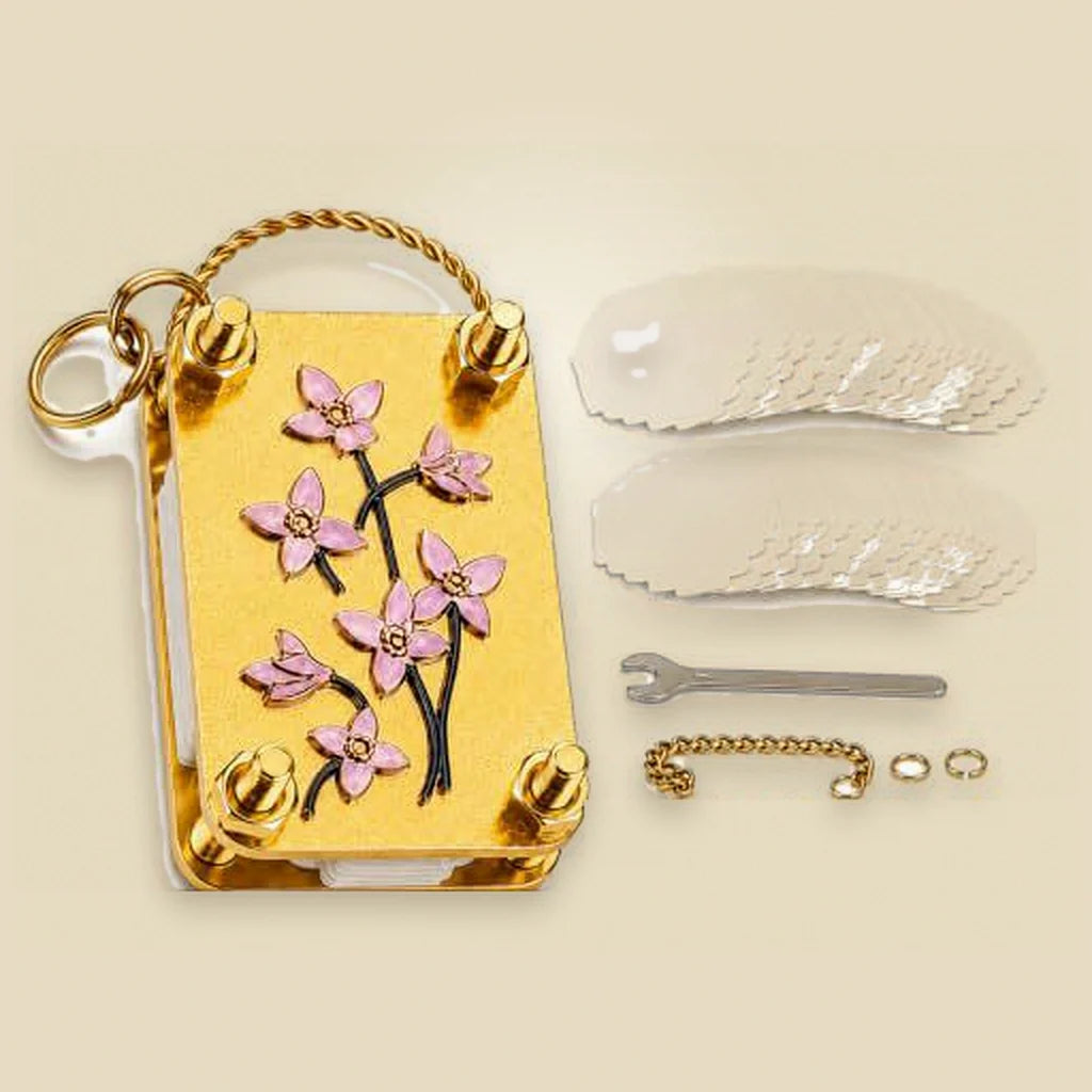 What's in the box: flower press, absorbent paper sheets, small wrench and chain